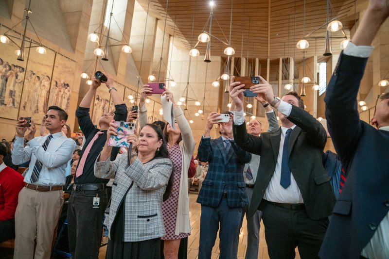 Staff and loved ones scramble to take photos during the 2026 Christian Service Awards Mass on March 10 at the Cathedral of Our Lady of the Angels. (John Rueda)