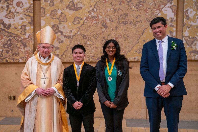 Archbishop José H. Gomez and Paul Escala, superintendent of LA Catholic schools, pose with students who were recipients at the 2026 Christian Service Awards Mass on March 10 at the Cathedral of Our Lady of the Angels. (John Rueda)
