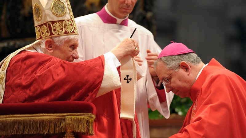 Pope Benedict XVI presents a pallium to Archbishop Jose H. Gomez of Los Angeles in St. Peter's Basilica at the Vatican June 29. (CNS photo/L'Osservatore Romano)