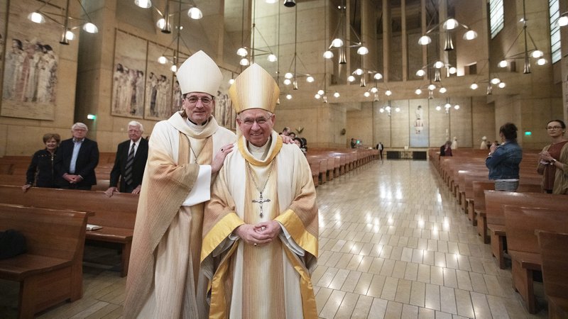 Then-Auxiliary Bishop Joseph Brennan poses with Archbishop José H. Gomez during Brennan’s farewell Mass in March 2019 to become the new bishop of the Diocese of Fresno. (Victor Alemán)