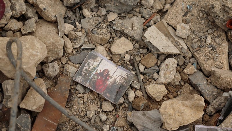 A photo lies amid the rubble of a house destroyed in an Israeli strike, amid escalating hostilities as the U.S.-Israel conflict with Iran continues, in Houmine El Tahta, Lebanon, April 1, 2026. (OSV News photo/Yara Nardi, Reuters)