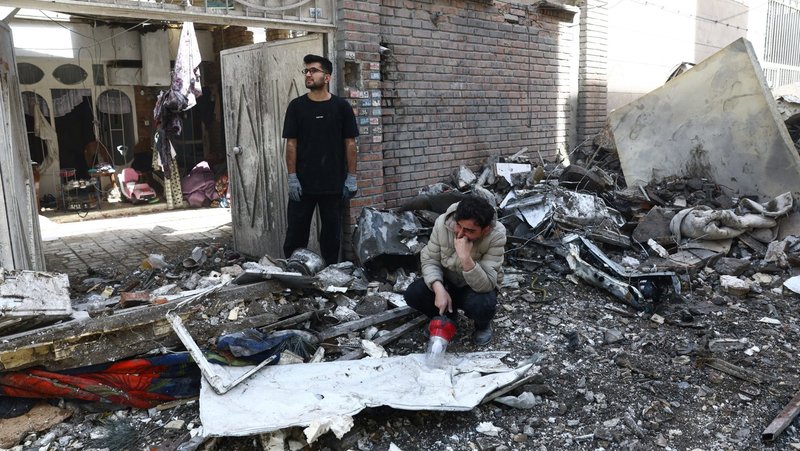 People react at the site of a residential building in Tehran, Iran, March 27, 2026, that was damaged by a strike amid the U.S.-Israeli war with Iran. (OSV News photo/Majid Asgaripour, West Asia News Agency via Reuters)