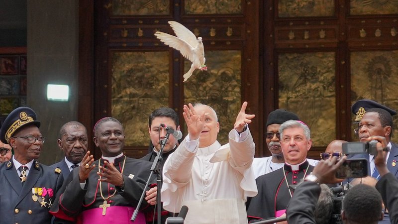 Pope Leo XIV releases a dove with community representatives at the conclusion of a peace meeting at St. Joseph Cathedral in Bamenda, Cameroon, April 16, 2026. (CNS photo/Lola Gomez)