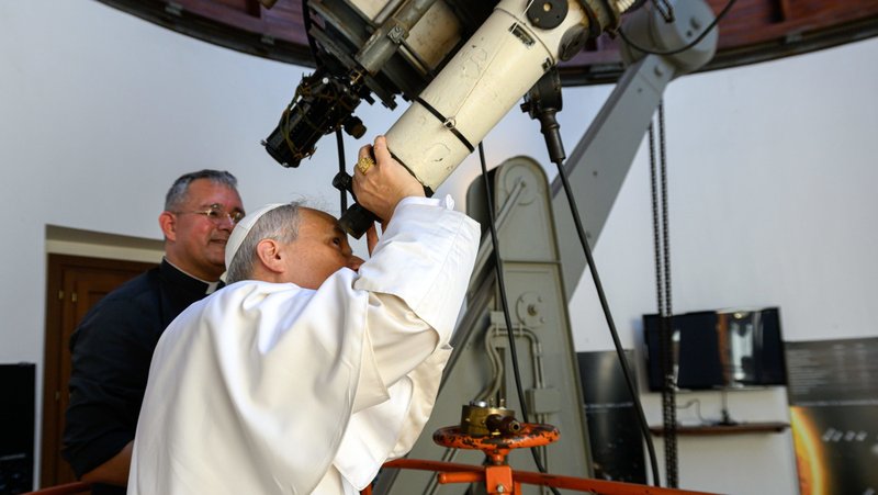 Pope Leo XIV looks through the main telescope of the Vatican Observatory in Castel Gandolfo, Italy, alongside U.S. Jesuit Father David A. Brown, an astronomer, July 20, 2025. The Vatican Observatory announced April 29, 2026, that an asteroid has been named in honor of Pope Leo XIII, who formally re-established the observatory in 1891. (CNS photo/Vatican Media)