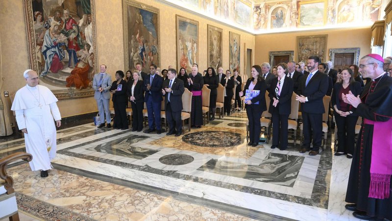 Members of the Catholic Charities USA board applaud as Pope Leo XIV enters for a meeting with the agency's directors in the Consistory Hall of the Apostolic Palace at the Vatican May 4, 2026. (OSV News photo/Mario Tomassetti, Vatican Media)