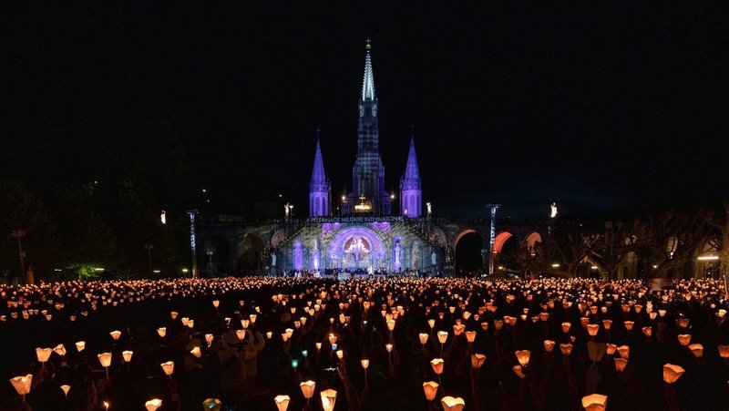 Attendees to a Marian procession hold candles in Lourdes, France in 2022. (OSV News /Tamino Petelinsek, courtesy Knights of Columbus)