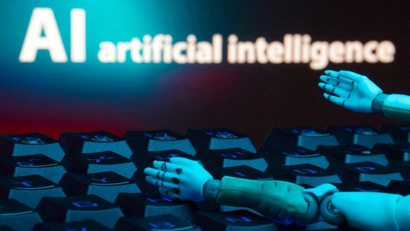 A message reading "AI artificial intelligence", a keyboard and robot hands are seen in this illustration taken Jan. 27, 2025. Pope Leo XIV approved the creation of an Interdicasterial Commission on Artificial Intelligence in a rescript released by the Vatican May 16, 2026. (OSV News photo/Dado Ruvic, Reuters)