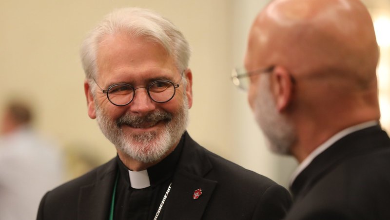 Archbishop Paul S. Coakley of Oklahoma City, now president of the U.S. Conference of Catholic Bishops, and Bishop James S. Wall of Gallup, N.M., share a light moment during a break June 16, 2023, at the USCCB'S spring plenary assembly in Orlando, Fla. The USCCB's 2026 spring assembly will be held in Orlando June 10-12, with public sessions scheduled for June 10 and 11. (OSV News photo/Bob Roller)
