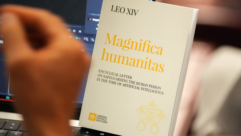 A copy of Pope Leo XIV’s first encyclical, “Magnifica Humanitas: On Safeguarding the Human Person in the Time of Artificial Intelligence,” is seen during a presentation on the document at the Vatican May 25, 2026. (CNS photo/Lola Gomez)