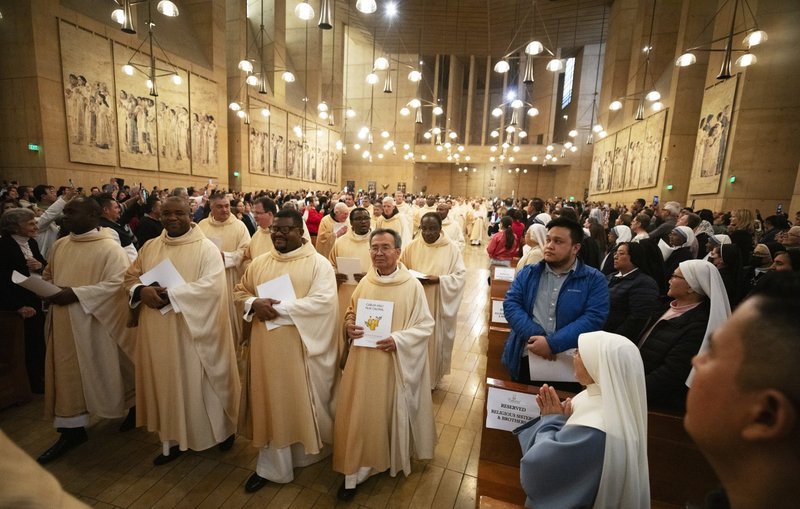 LA priests process into the Cathedral of Our Lady of the Angels during the Chrism Mass in 2024. (Victor Alemán)