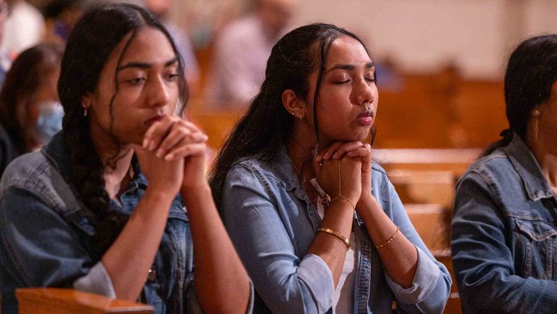 Two young women participate in a worldwide rosary for peace May 30, 2026, at the Basilica of the National Shrine of the Immaculate Conception in Washington. Archbishop Gabriele G. Caccia, apostolic nuncio to the United States, led the rosary at the basilica, while Pope Leo XIV presided over the Marian devotion from the Lourdes grotto in the Vatican Gardens, uniting Marian shrines around the world. (OSV News photo/Mihoko Owada, Catholic Standard)