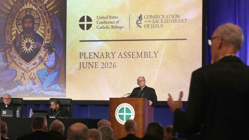 Bishop Barry C. Knestout of Richmond, Va., chairman of the bishops' Committee on the Protection of Children and Young People, listens as Baltimore Auxiliary Bishop Adam J. Parker asks a question during a June 11, 2026, session of the annual spring meeting of the U.S. Conference of Catholic Bishops in Orlando, Fla. (OSV News photo/Bob Roller)