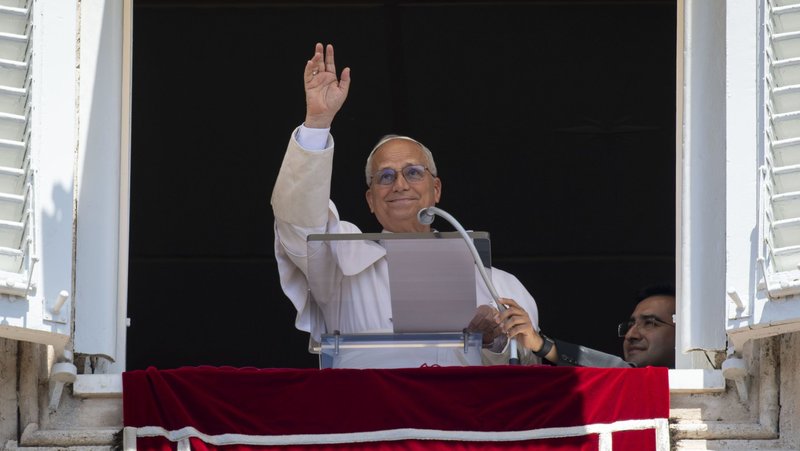 Pope Leo XIV waves to the crowd as he leads the Angelus in St. Peter's Square at the Vatican June 14, 2026. (OSV News photo/Matteo Pernaselci, Vatican Media)