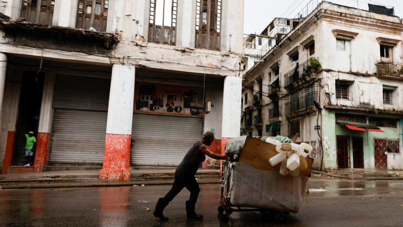 A man pushes a wheelbarrow loaded with collected plastic containers in Havana June 8, 2026. The Cuban government on June 18 announced far-reaching economic measures that could mark the most significant shift toward a market economy since the 1959 revolution. (OSV News photo/Norlys Perez, Reuters)