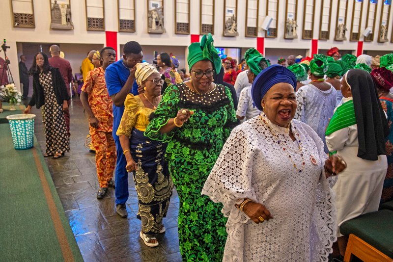 Parishioners at St. Eugene Church in South LA sing during a special May 31 Mass with Cardinal Peter Ebere Okpaleke of Ekwulobia, Nigeria, who visited LA as part of a tour visiting Nigerian Catholics living in the U.S. (Michael Goulding)