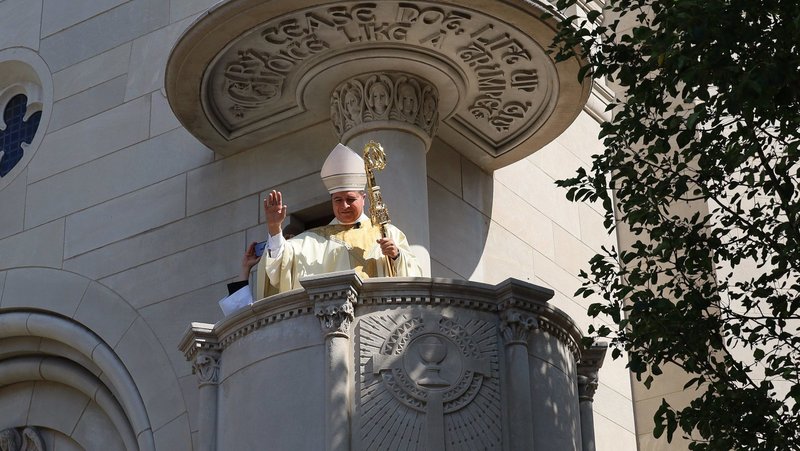 In the outdoor ambo of the Cathedral of St. Joseph in Wheeling, W.Va., July 2, 2026, Bishop Evelio Menjivar-Ayala gives a blessing to all gathered below who packed the streets around the church following Mass for his installation as bishop of Wheeling-Charleston. (OSV News/Colleen Rowan, The Catholic Spirit)