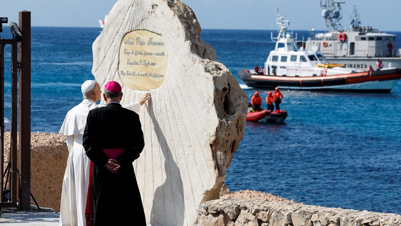Pope Leo XIV blesses a plaque at Molo Favaloro in Lampedusa, Italy, and dedicates the pier to Pope Francis as he visits the island, a key entry point for migrants crossing the Mediterranean Sea, during a pastoral trip July 4, 2026. (OSV News photo/Reuters, Remo Casilli)