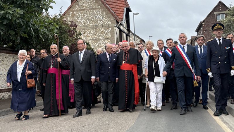 Cardinal Jean-Marc Aveline of Marseille, president of the French bishops' conference, center, joins politicians, bishops and family in a silent march to the Church of Saint-Étienne July 26, 2026, to mark the 10th anniversary Mass of Father Jacques Hamel in Saint-Étienne-du-Rouvray, France. The 85-year-old priest was murdered there by two Islamic terrorists as he was celebrating Mass July 26, 2016. (OSV News photo/Antoine-Marie IZOARD/Catholic Press Photo)