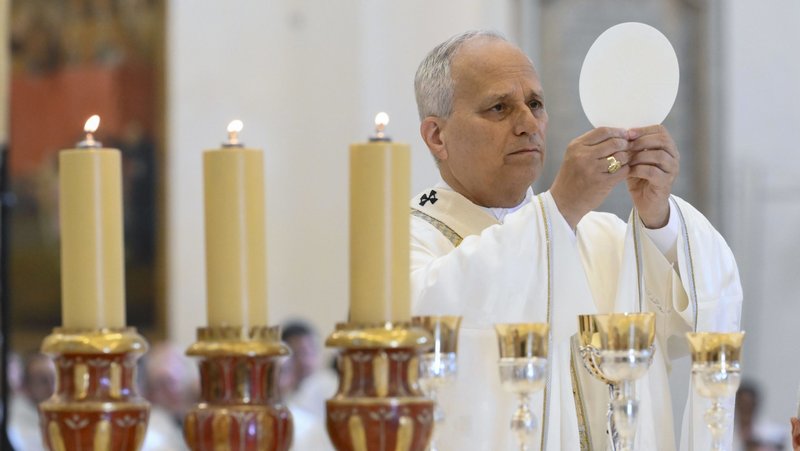 Pope Leo XIV elevates the host as he celebrates Mass at the Basilica of St. Mary of the Angels in Assisi, Italy, Aug. 6, 2026, the feast of the Transfiguration of the Lord. (OSV News/Mario Tomassetti, Vatican Media)