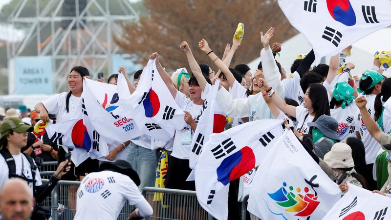 Pilgrims from South Korea celebrate Aug. 3, 2025, as Pope Leo XIV confirmed Aug. 3-8, 2027, as the dates for World Youth Day in South Korea. His confirmation came the day of the closing Mass for the Jubilee of Youth at the Tor Vergata open-air field. (OSV photo/Remo Casilli, Reuters)