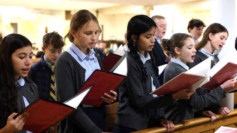 Students are seen in a Jan. 21, 2026, photo, singing during Mass at Regina Pacis Academy in Norwalk, Conn. Regina Pacis Academy, a preschool-to-eighth-grade independent Catholic school, was founded as a tech-free classical school. Instead of smartboards, devices and a computer lab, the academy has chalkboards, textbooks and a well-stocked library, said Kimberly Quatela, its principal. (OSV News photo/courtesy Regina Pacis Academy)