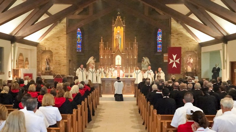 Members of the Order of Malta attend Mass during the organization’s annual pilgrimage in August to the National Shrine of Our Lady of Champion in Wisconsin. (Keith Farley)