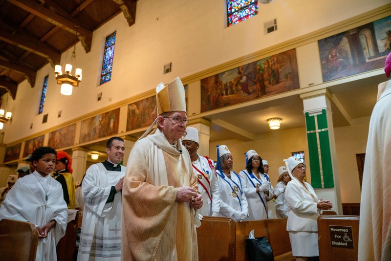 Archbishop José H. Gomez processes in to begin the Sept. 6 Mass of Thanksgiving at Transfiguration Church for Greg Warner Sr.’s election as supreme navigator of the national Knights of Peter Claver. (John Rueda)