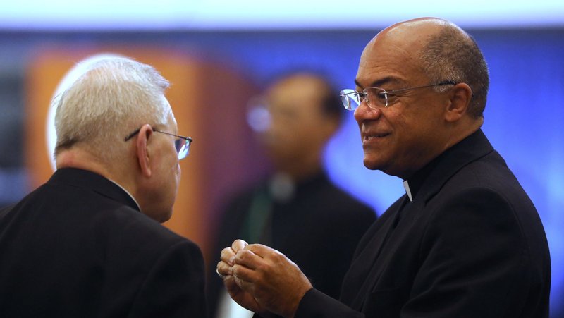 New Orleans Archbishop Gregory M. Aymond, and Archbishop Shelton J. Fabre of Louisville, Ky., speaks during a break at a Nov. 15, 2023, session of the fall general assembly of the U.S. Conference of Catholic Bishops in Baltimore. "Let us foster an economy that values the God given dignity of each person," said Archbishop Fabre, chairman of the U.S. Conference of Catholic Bishops' Committee on Domestic Justice and Human Development, in a statement released ahead of Labor Day, Sept. 7, 2026. (OSV News photo/Bob Roller)