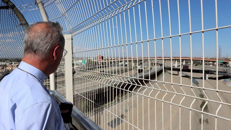 Archbishop Stefan Hesse of Hamburg, who is the special representative for refugee issues for the German Bishops' Conference, looks through the U.S.-Mexico border fence Aug. 25, 2026, after returning from Ciudad Juárez, Mexico, to El Paso, Texas. (OSV News photo/Daniela Elpers, courtesy German Bishops Conference)