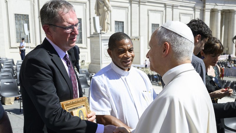 Pope Leo XVI greets Belarusian journalist Andrzej Poczobut during the pontiff's general audience in St. Peter's Square at the Vatican Sept. 2, 2026. Poczobut, a Catholic dissident, returned to Belarus Sept. 8, after five months in exile in Poland, saying he was prepared to risk arrest and urging Western Catholics to remember Christians imprisoned by the Alexander Lukashenka regime. (OSV News photo/Mario Tomassetti, Vatican Media/Catholic Press Photo)
