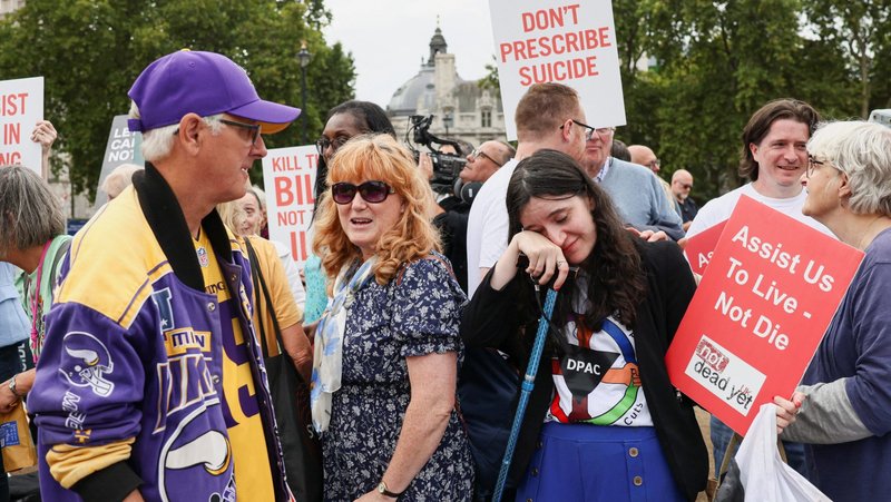 Demonstrators against assisted dying react in front of the Houses of Parliament in London Sept. 11, 2026, as U.K. lawmakers voted 286-270 to reject a bill that would allow terminally ill adults in England and Wales to choose to end their lives. (OSV News photo/Jack Taylor, Reuters)