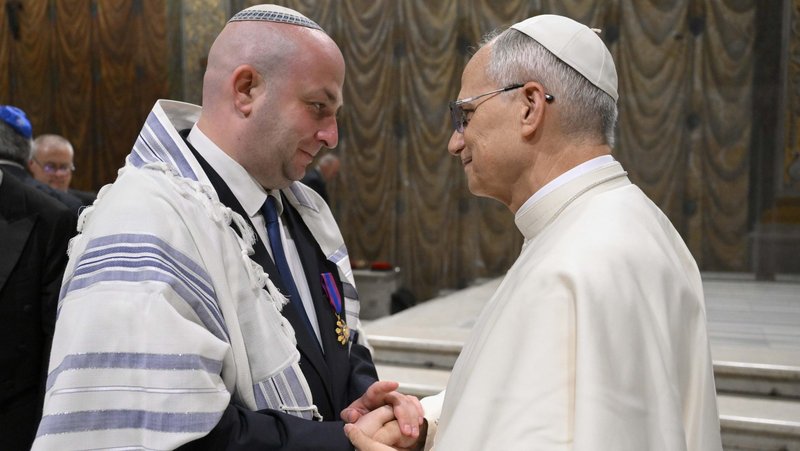 Pope Leo XIV greets Silviu Vexler, president of the Federation of Jewish Communities in Romania, during a ceremony honoring Blessed Iuliu Hossu in the Sistine Chapel at the Vatican June 2, 2025. (CNS photo/Vatican Media)