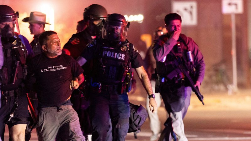 Police detain a protester in Austin, Texas, Sept. 20, 2026, after they issued dispersal orders at the site where city officials said that an Immigration and Customs Enforcement agent was involved in a shooting earlier in the day. Bishop Daniel E. Garcia of Austin, Texas, spoke out that day against the ICE-involved shooting saying "people are living in terror and fear." (OSV News photo/Nuri Vallbona, Reuters)