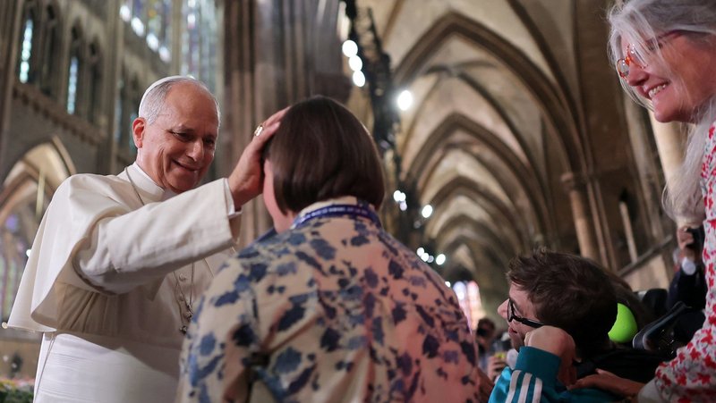 Pope Leo XIV blesses a woman as he celebrates Mass at the Metz Cathedral in France Sept. 28, 2026, the final day of his four-day apostolic journey to the country. (OSV News photo/Christian Hartmann, Reuters)