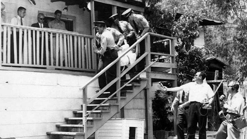Los Angeles County sheriffs forcibly evict Mrs. Aurora Vargas from her home at 1771 Malvina Avenue in Chávez Ravine on May 9, 1959, as media representatives recorded the event. The family put up a fight and reported they had only received a written eviction notice, causing criticism of the government’s methods. (Wikimedia Commons)