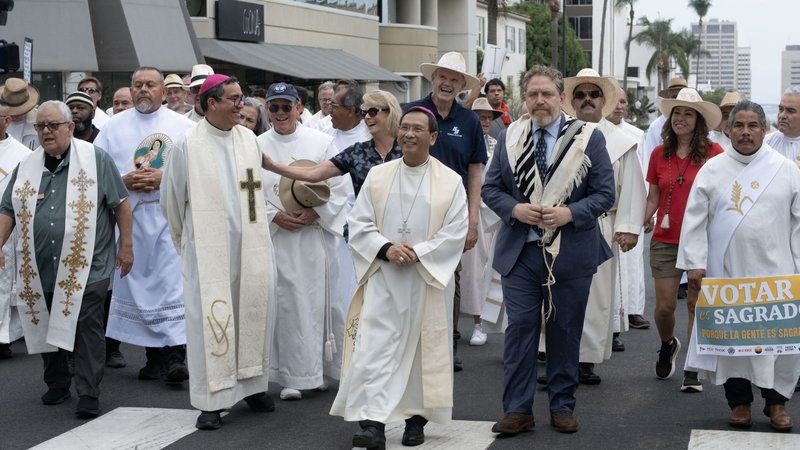 San Diego Bishop Michael M. Pham, center, leads more than 4,000 people who gathered Sept. 27, 2026, World Day of Migrants and Refugees, in Balboa Park to support immigrants and to proclaim that "All Are Sacred." Dozens of faith leaders participated in the event, including, left to right, Jesuit Father Eduardo Samaniego, San Diego Auxiliary Bishop Felipe Pulido, Rabbi Mike Rothbaum and Deacon Carlos Morales. (OSV News photo/David Maung, Diocese of San Diego)