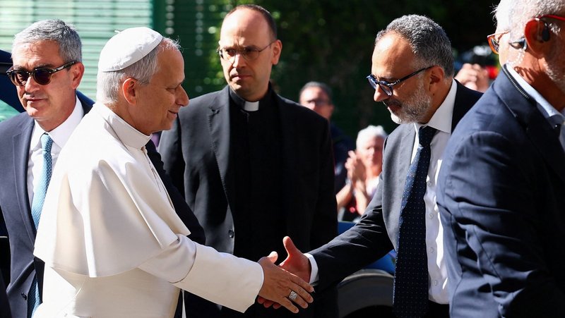 Pope Leo XIV is greeted by his personal physician, Luigi Carbone, as the pontiff arrives at Rome's Gemelli Hospital Oct. 13, 2026, ahead of his surgery that afternoon to remove a lung nodule. The Vatican confirmed that evening that Pope Leo has lung cancer. (OSV News photo/Guglielmo Mangiapane, Reuters)