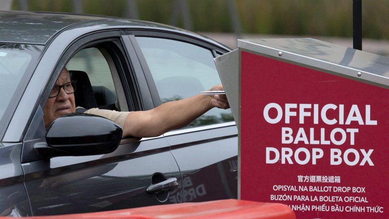 A person drops off an election ballot at a drive-through ballot drop box during the California primary election in San Diego June 2, 2026. (OSV News/Mike Blake, Reuters)