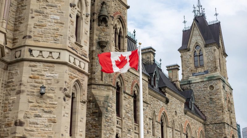 A Canadian flag waves near the Parliament Hill building in Ottawa. (Hank Mika/Shutterstock via EWTN)
