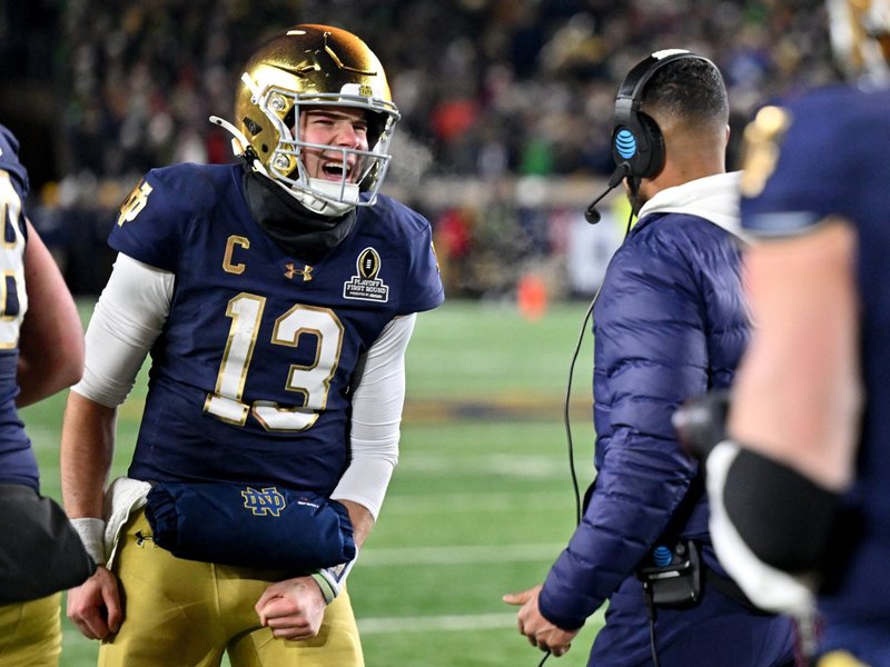 Notre Dame Players Head to Championship Formed by Pre-Game Masses, Saint Devotions