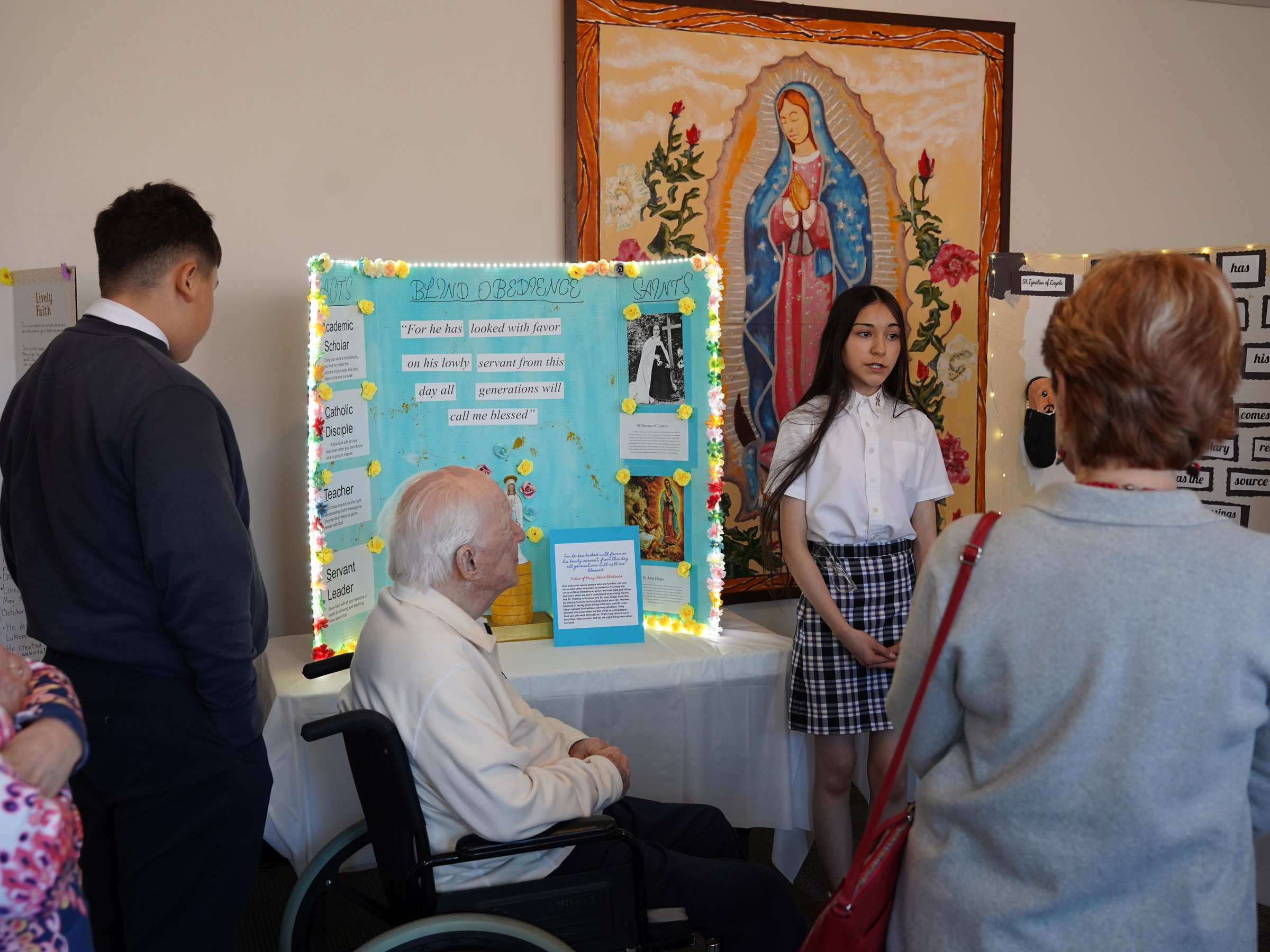 A Holy Redeemer eighth-grader explains the Magnificat to alumni and benefactors.