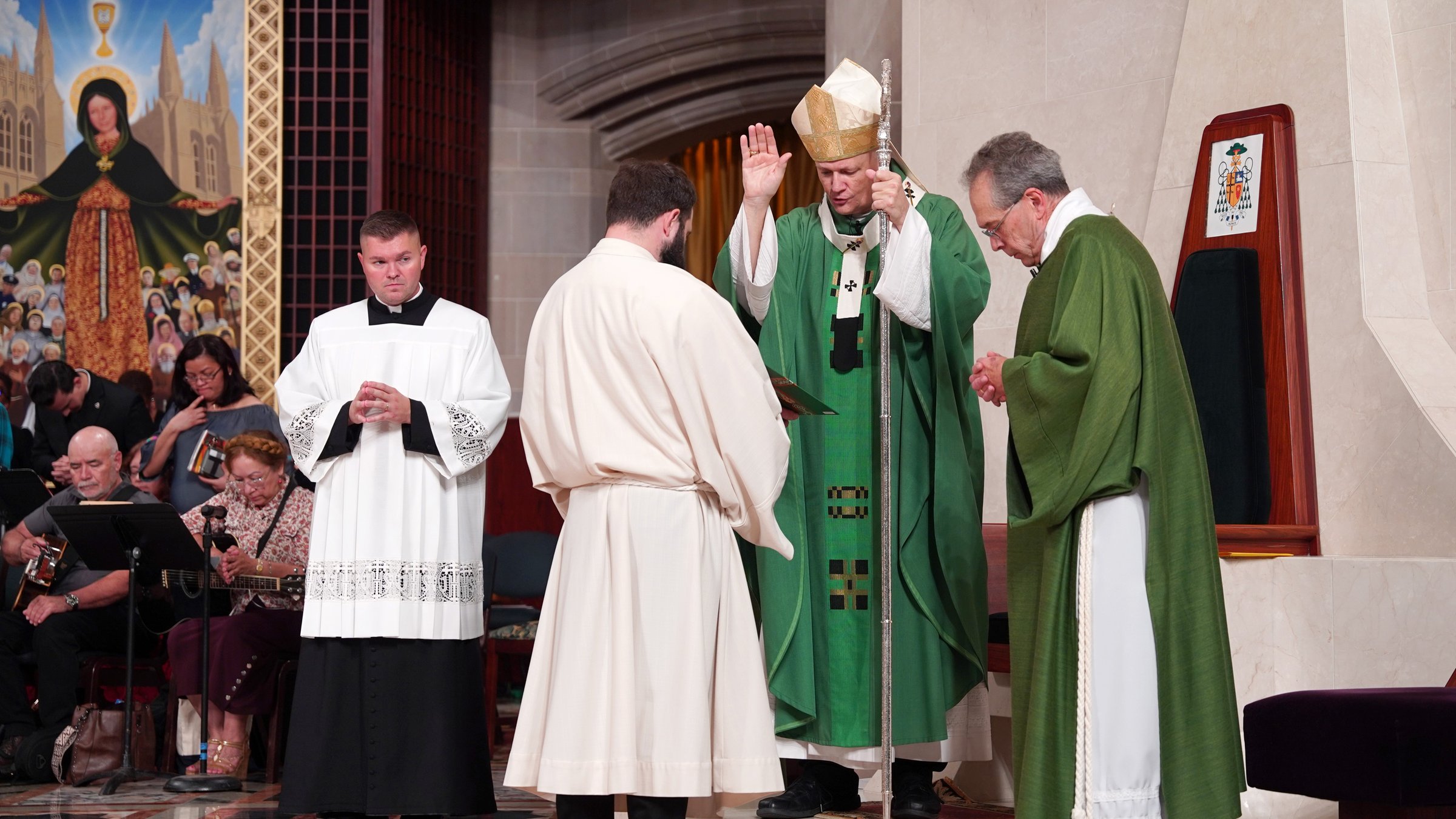 Archbishop Edward J. Weisenburger imparts an apostolic blessing during the Jubilee of Migrants Mass in Detroit.
