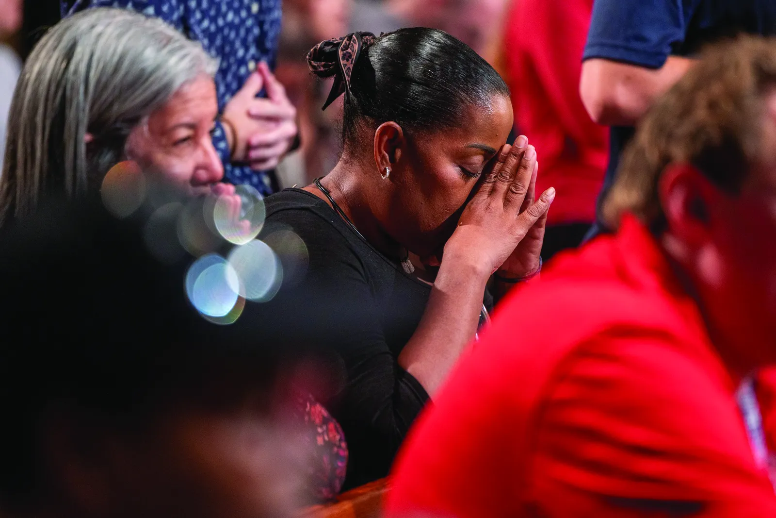 A woman prays during a Sept. 11, 2026, Mass at the Basilica of the National Shrine of the Immaculate Conception in Washington commemorating the 25th anniversary of Sept. 11, 2001, terrorist attacks. (OSV News photo/Mihoko Owada)