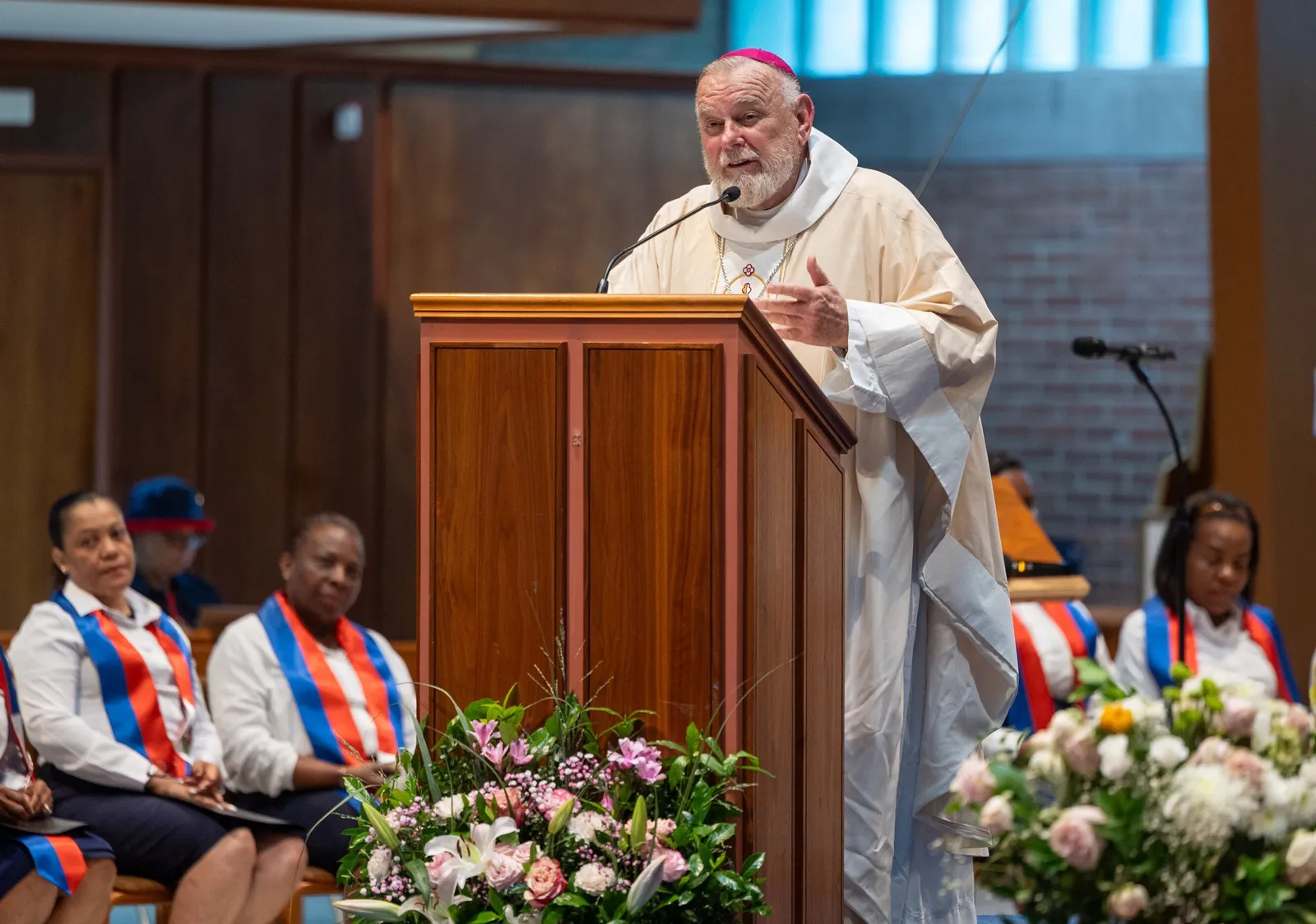 Archbishop Thomas G. Wenski of Miami speaks at Our Lady of Sorrows Church in Takoma Park, Maryland, on July 28, 2026 during a Mass of Solidarity with the Haitian community and those impacted by changes to immigration policy. (Catholic Standard photo by Mihoko Owada)