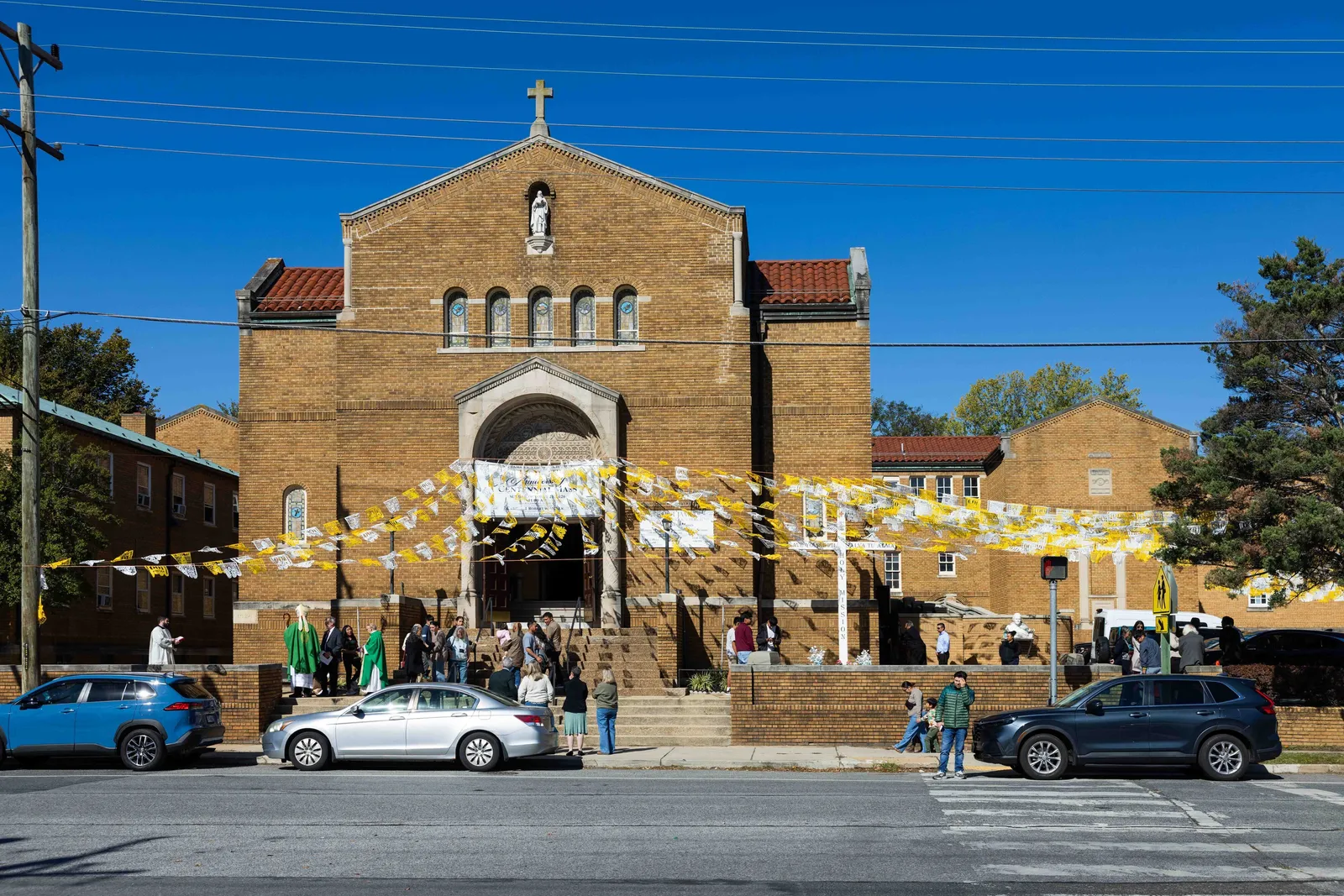 Decorations strung over the parking lot and across the church’s entrance commemorated the 100th anniversary of St. James Church in Mount Rainier, where Washington Cardinal Robert W. McElroy celebrated a Mass marking that milestone on Oct. 25, 2026. (Catholic Standard photos by Andrew Biraj)