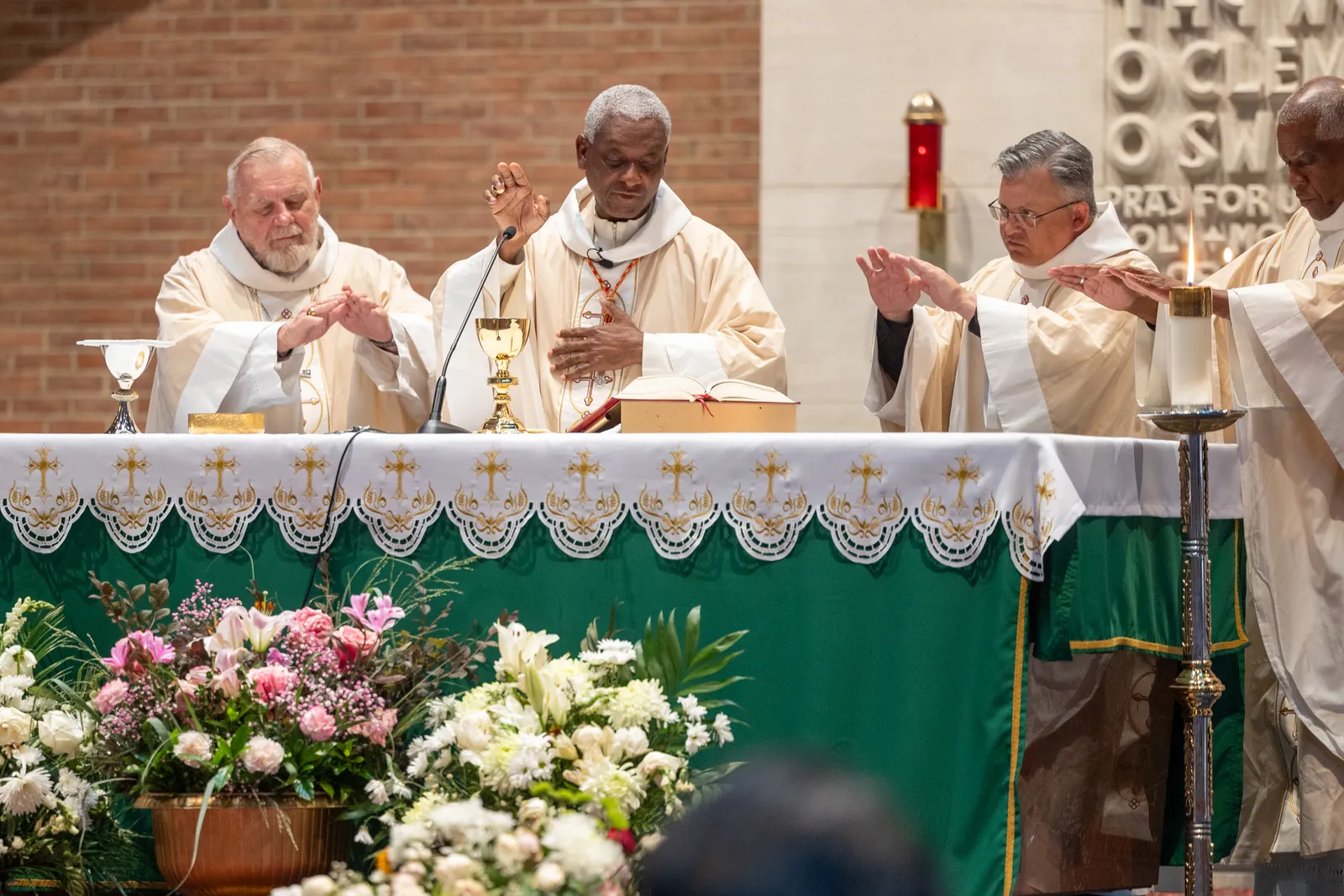 Cardinal Chibly Langlois of Les Cayes, Haiti, (second from left), celebrates a Mass of Solidarity with the Haitian community and those impacted by changes to immigration policy. The concelebrants at the Mass at Our Lady of Sorrows Church in Takoma Park, Maryland, on July 28, 2026 included Archbishop Thomas G. Wenski of Miami at left, and Archbishop Robert G. Casey of Cincinnati and Bishop Jacques Fabre-Jeune, CS, of Charleston, South Carolina at right. (Catholic Standard photo by Mihoko Owada)