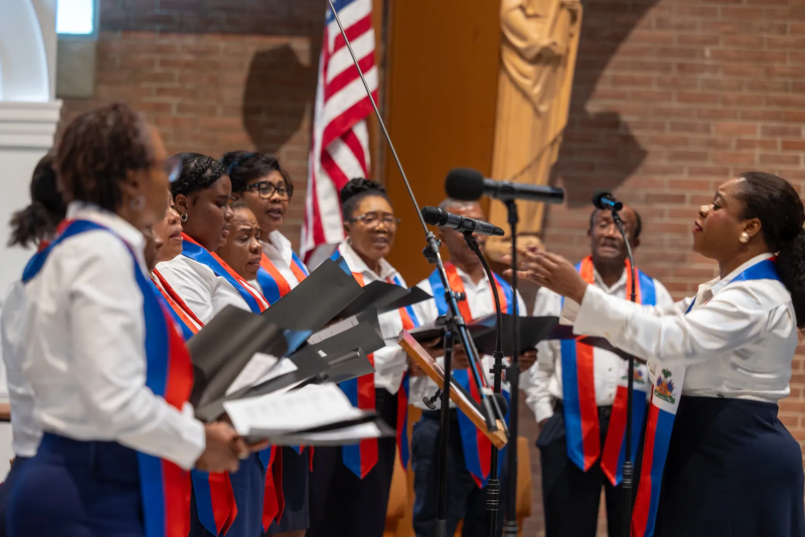 Choir members sing at Our Lady of Sorrows Church in Takoma Park, Maryland, on July 28, 2026 during a Mass of Solidarity with the Haitian community and those impacted by changes to immigration policy. (Catholic Standard photo by Mihoko Owada)