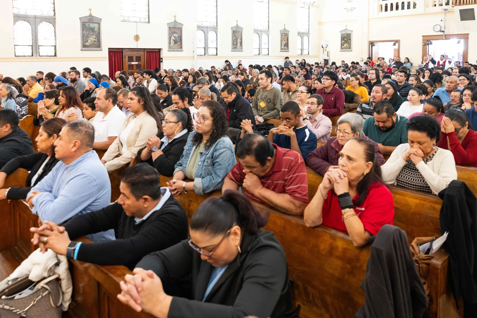 A 100th anniversary Mass for St. James Church in Mount Rainier, Maryland, celebrated by Washington Cardinal Robert W. McElroy drew hundreds of people, including people standing in the church’s vestibule and along its walls. (Catholic Standard photos by Andrew Biraj)