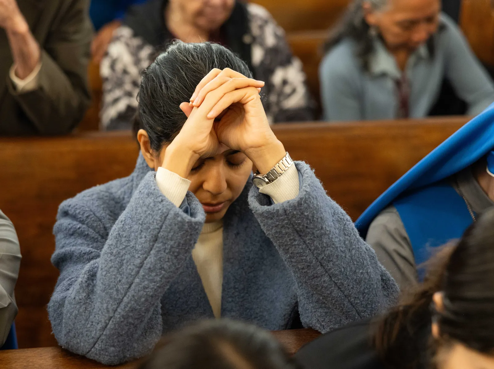 People pray during a Mass on Oct. 25, 2026 marking the 100th anniversary of St. James Church in Mount Rainier, Maryland. (Catholic Standard photos by Andrew Biraj)