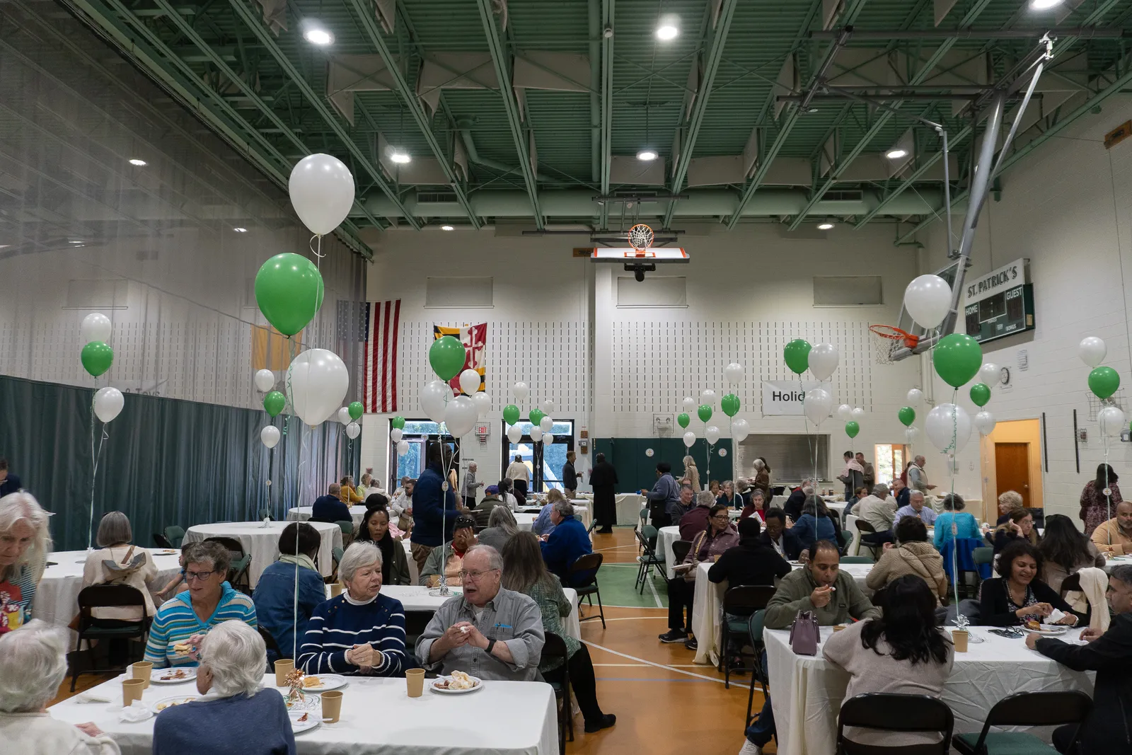 Following a Mass and outdoor Eucharistic procession on Oct. 18 marking the 60th anniversary of St. Patrick Parish in Rockville, people gathered for a reception in the parish center, and family activities included face painting and servings of ice cream. (Catholic Standard photos by Margaret Ardillo)